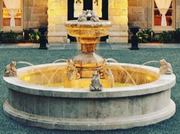 Hand carved rounded limestone pool fountain with urn