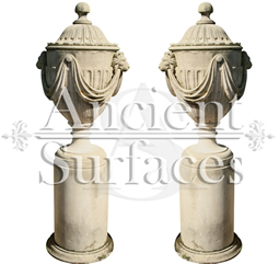 Antique Lion Headed and Draped Limestone Planter Pair