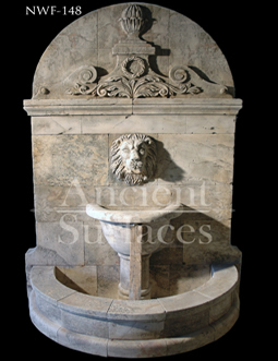 Hand carved lion stone wall fountain